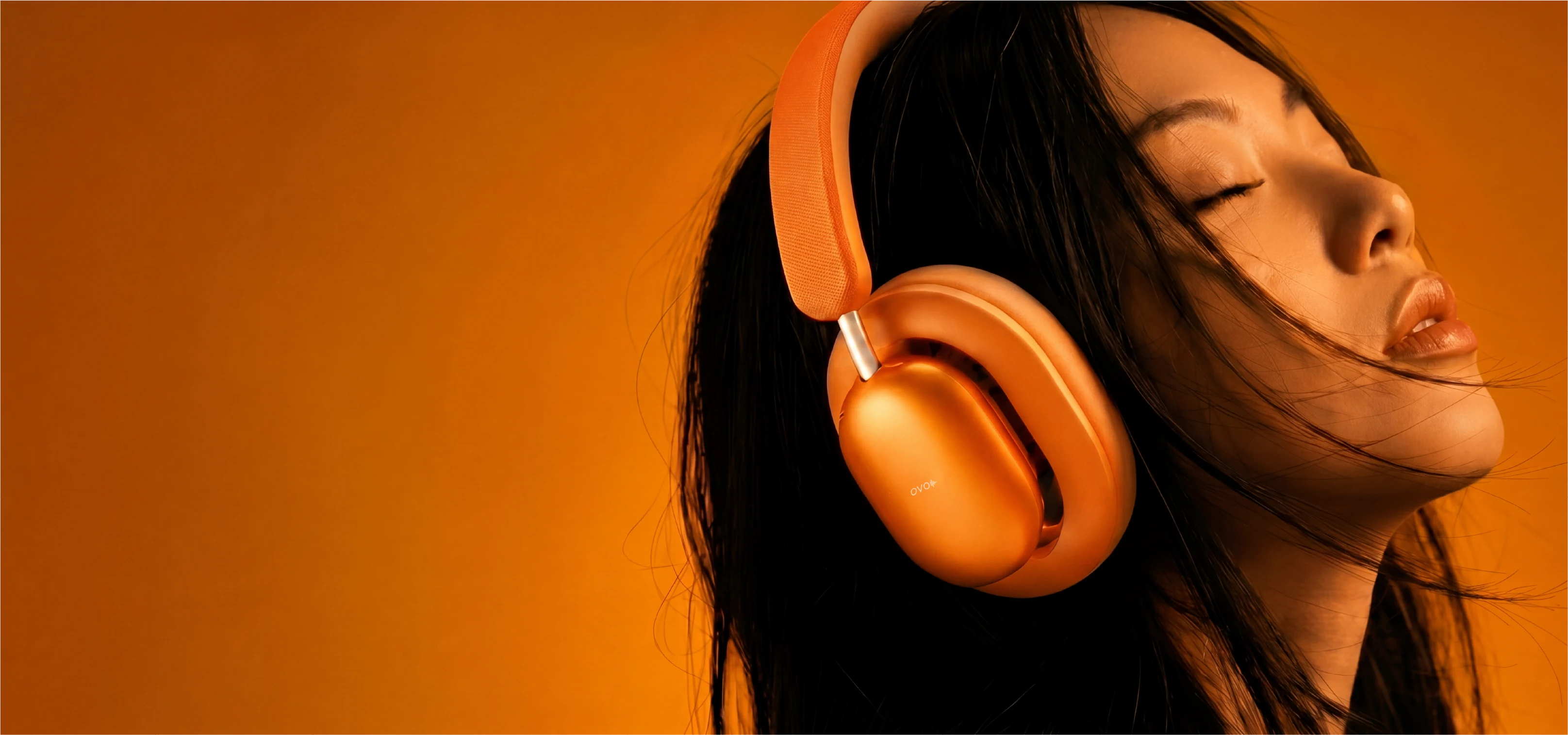 Person wearing orange RELOD OVO Air headphones with a warm, orange-toned background1621243260e1af0c20-0