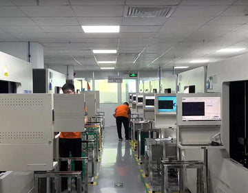 Factory floor with workers and automated equipment in a manufacturing setting